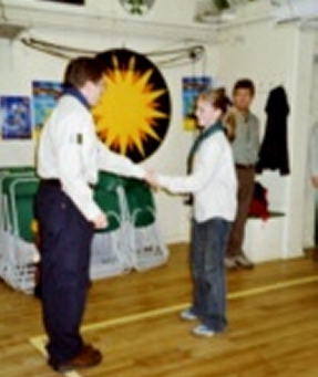 Beavers Helper - Young Leader Catherine Weeks being invested 15th December  2003